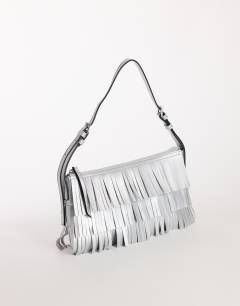 Model wearing Sasha small fringe shoulder bag in silver