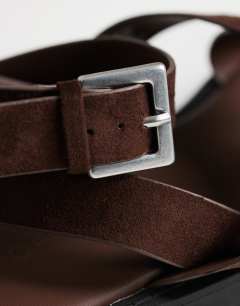 Model wearing Sasha strappy flat sandal in chocolate