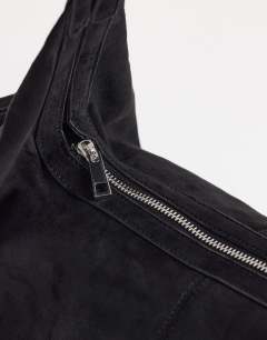 Model wearing Saskia large suedette shoulder bag in black