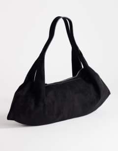 Model wearing Saskia large suedette shoulder bag in black