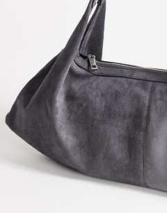 Model wearing Saskia large suedette shoulder bag in grey