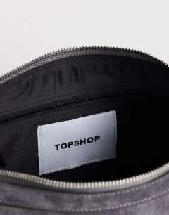 Model wearing Saskia large suedette shoulder bag in grey