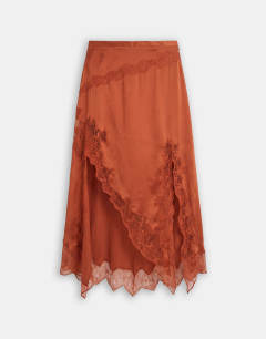 Model wearing Satin and lace hanky hem midi skirt in rust