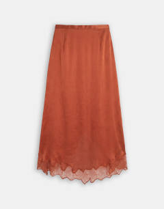 Model wearing Satin and lace hanky hem midi skirt in rust
