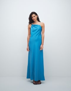 Model wearing Satin asym beaded neck maxi occasion dress in blue