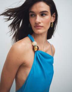 Model wearing Satin asym beaded neck maxi occasion dress in blue