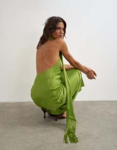 Model wearing Satin asymmetric halter neck maxi dress with fringed scarf in green