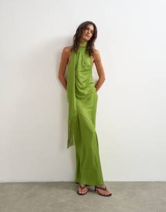 Model wearing Satin asymmetric halter neck maxi dress with fringed scarf in green