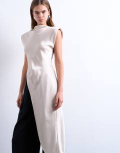Model wearing Satin asymmetric hem tunic top with shoulder pads in oyster