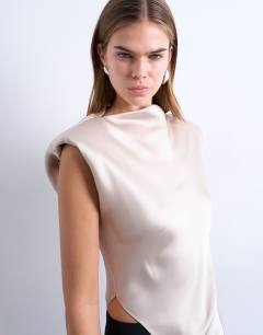 Model wearing Satin asymmetric hem tunic top with shoulder pads in oyster
