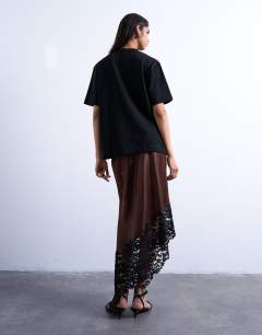 Model wearing Satin asymmetric lace hem maxi skirt in chocolate