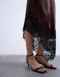 Model wearing Satin asymmetric lace hem maxi skirt in chocolate