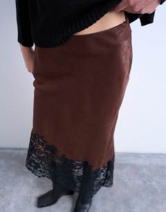Model wearing Satin asymmetric lace hem midaxi skirt in brown with black lace 