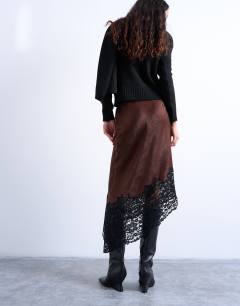 Model wearing Satin asymmetric lace hem midaxi skirt in brown with black lace 