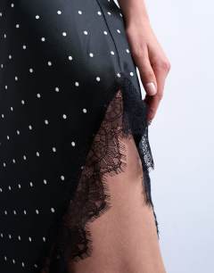 Model wearing Satin asymmetric lace trim midi slip dress in black polka dot