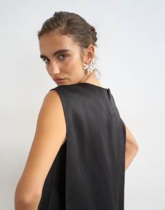 Model wearing Satin asymmetric pleat detail cape back mini dress in black
