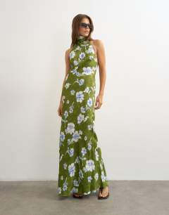 Model wearing Satin bias collapsed funnel halter neck maxi dress with open back in green floral