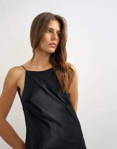 Model wearing Satin bias halter neck open scoop back maxi dress in black