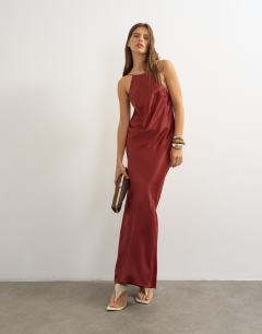 Model wearing Satin bias halter neck open scoop back maxi dress in burnt red