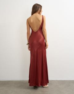 Model wearing Satin bias halter neck open scoop back maxi dress in burnt red