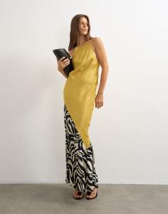 Model wearing Satin bias halter neck open scoop back maxi dress in colour block animal