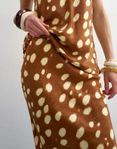 Model wearing Satin bias maxi skirt in deer print