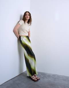 Model wearing Satin bias maxi skirt in lime ombre stripe