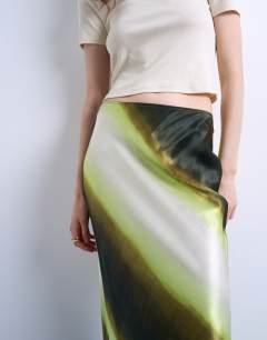 Model wearing Satin bias maxi skirt in lime ombre stripe