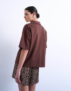 Model wearing Satin boxer short in brown polka dot