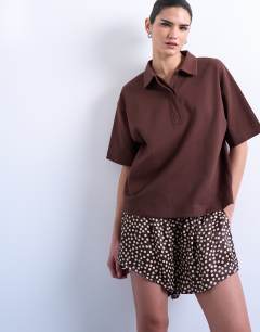 Model wearing Satin boxer short in brown polka dot
