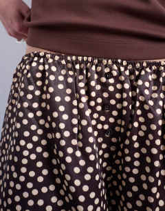 Model wearing Satin boxer short in brown polka dot