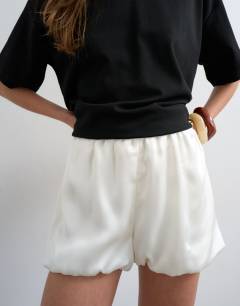 Model wearing Satin bubble shorts in ivory