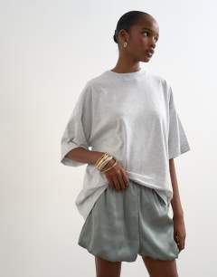 Model wearing Satin bubble shorts in sage