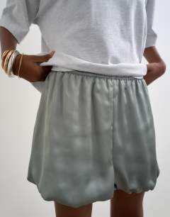 Model wearing Satin bubble shorts in sage