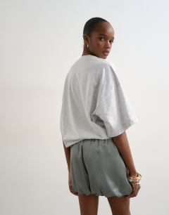 Model wearing Satin bubble shorts in sage