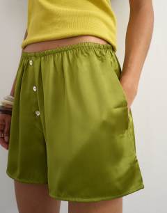 Model wearing Satin button detail short in green