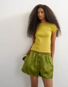 Model wearing Satin button detail short in green