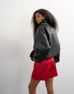 Model wearing Satin button detail short in red