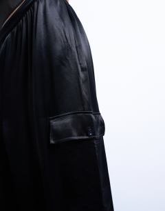 Model wearing Satin cargo balloon trouser in black