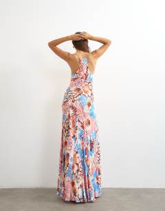 Model wearing Satin cut away racer neck full skirt maxi dress in blue and pink bold floral