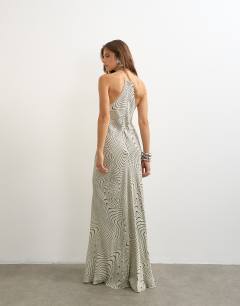 Model wearing Satin cut away racer neck full skirt maxi dress in mono wavy print