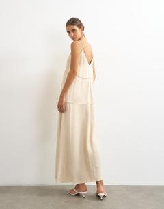 Model wearing Satin double layered cami maxi dress with seam details in stone