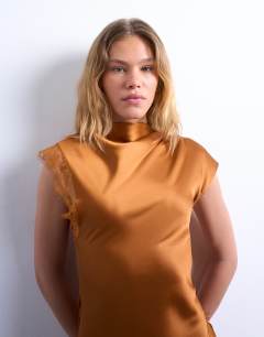 Model wearing Satin drape neck maxi dress with lace trim in caramel