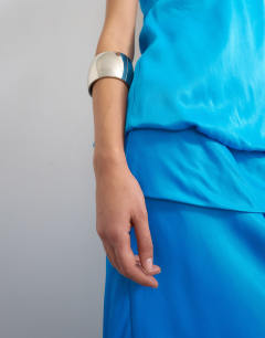 Model wearing Satin dropped waist blouson bandeau in cornflower blue