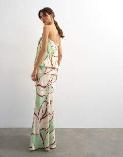 Model wearing Satin dropped waist blouson bandeau in green floral