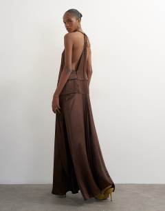 Model wearing Satin dropped waist low armhole maxi dress in chocolate