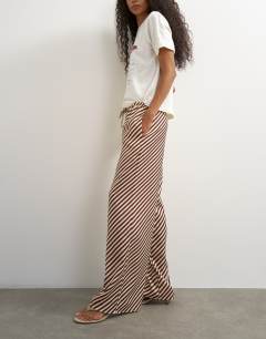 Model wearing Satin feel straight leg trouser in burgundy stripe