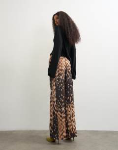 Model wearing Satin feel straight leg trouser in porcupine print