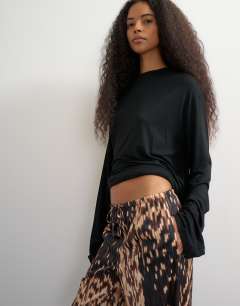 Model wearing Satin feel straight leg trouser in porcupine print