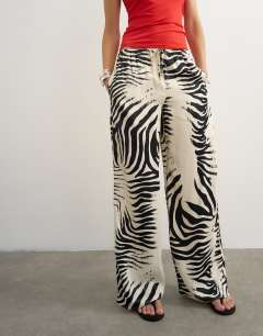 Model wearing Satin feel straight leg trouser in zebra print